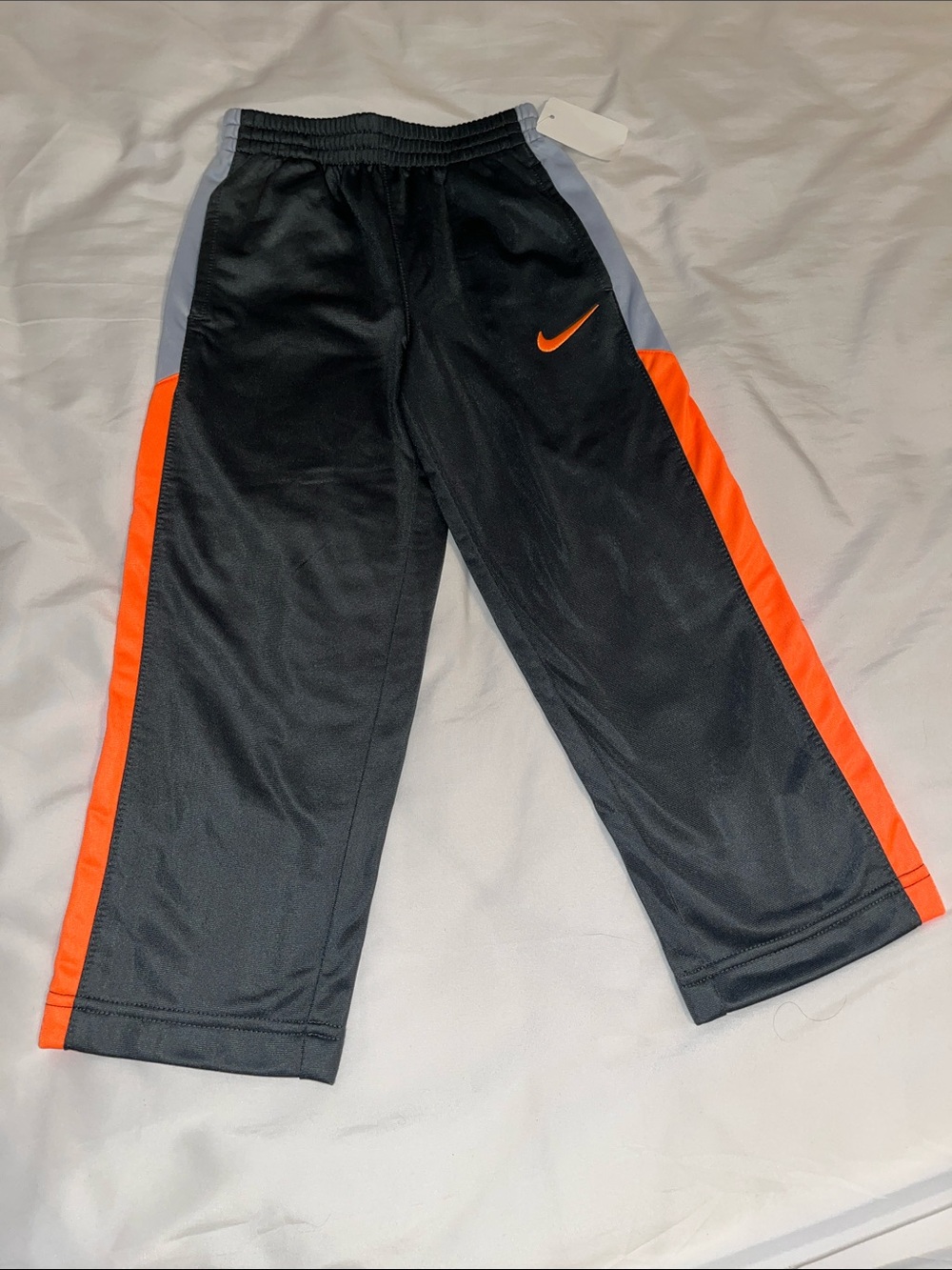 Nike Kids Sz 4 Black Joggers with Orange and Gray Stripe. New
